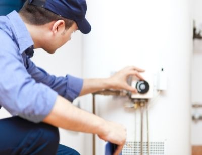 Man fixing a water heater